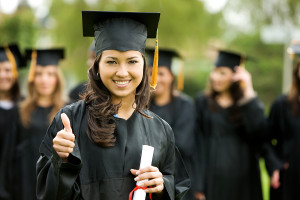 graduation girl holding her diploma with pride